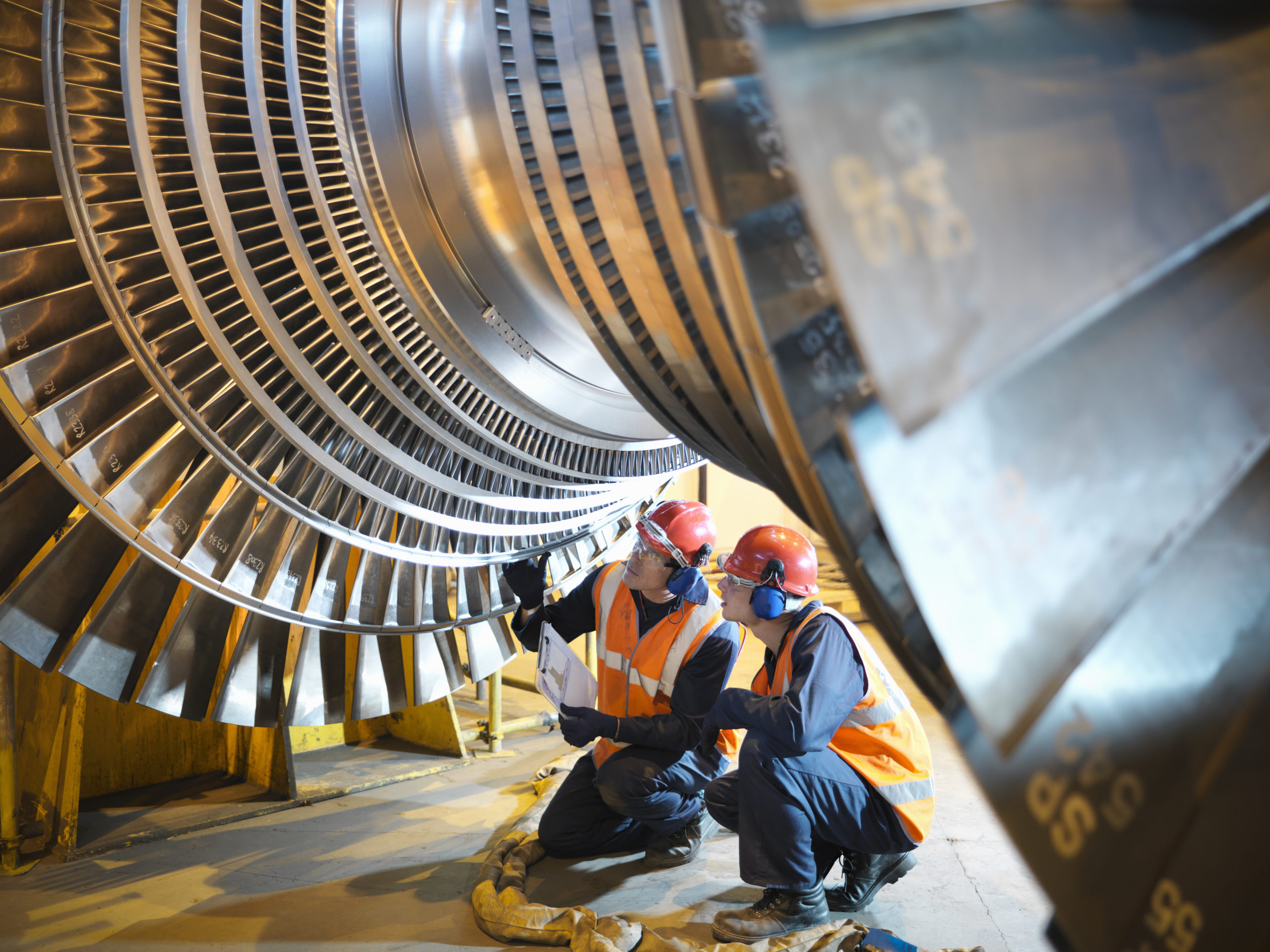 Workers inspecting turbine